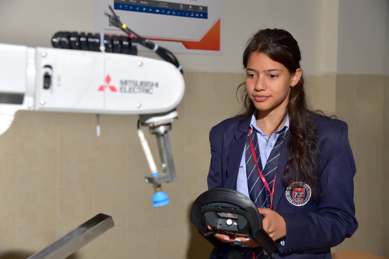 Student operating Robotic Arm